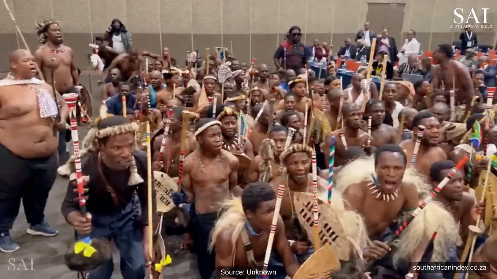 Zulu regiments carrying shields and sticks inside the Durban ICC during the Ingonyama Trust indaba.